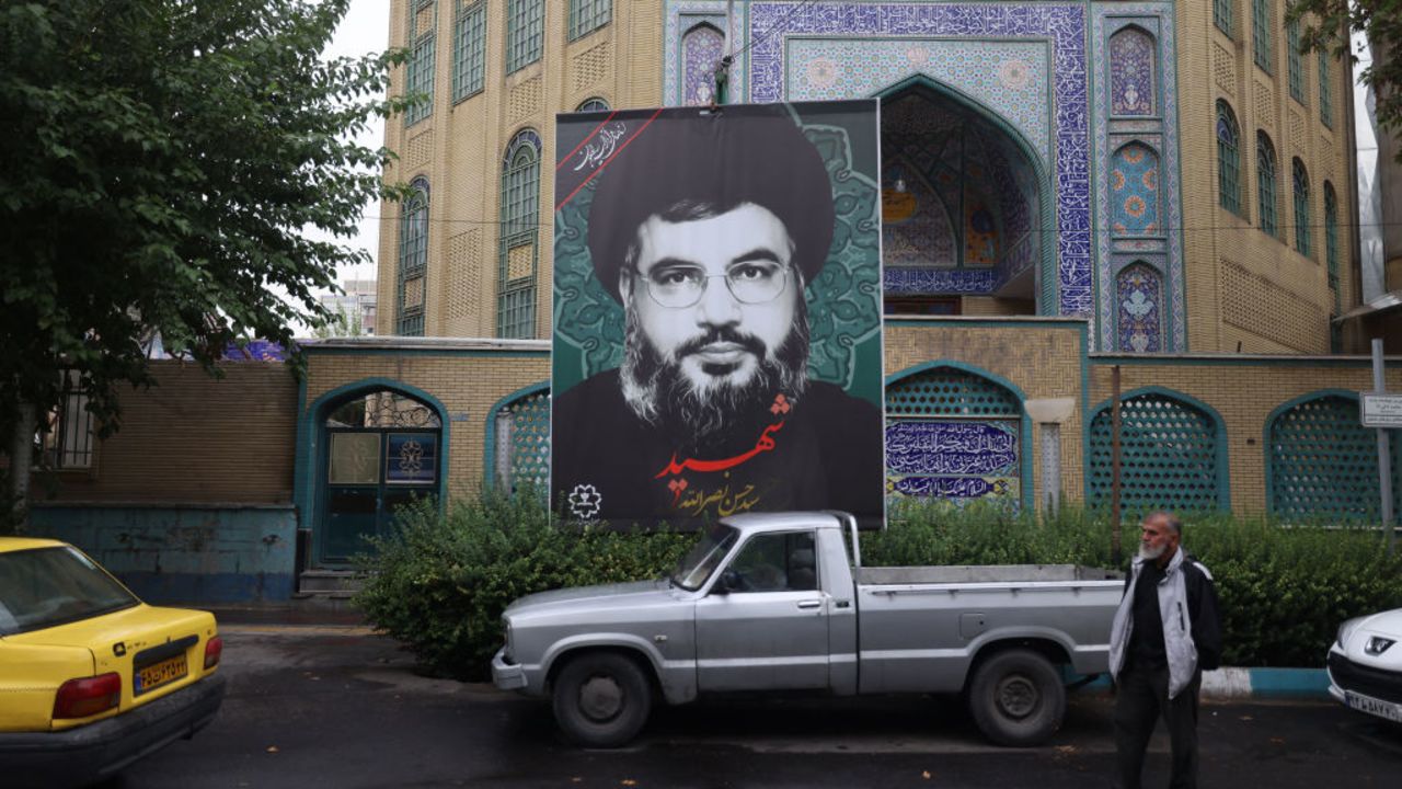 A billboard with a picture of Lebanon's Hezbollah leader Hassan Nasrallah, who was killed in an Israeli airstrike on the southern outskirts of Beirut on September 27, is displayed in Tehran on September 30, 2024. (Photo by ATTA KENARE / AFP) KENARE/AFP via Getty Images)