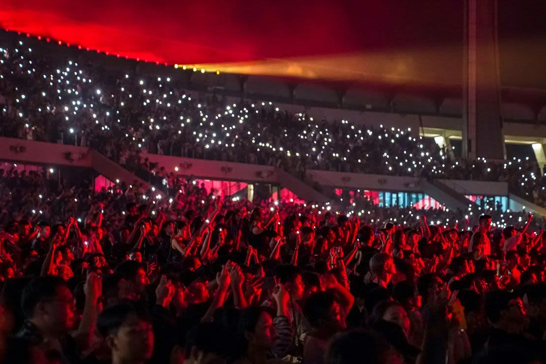 Fans cheer during Kanye West's Vulture listening experience at Wuyuan River Stadium on September 15, 2024.