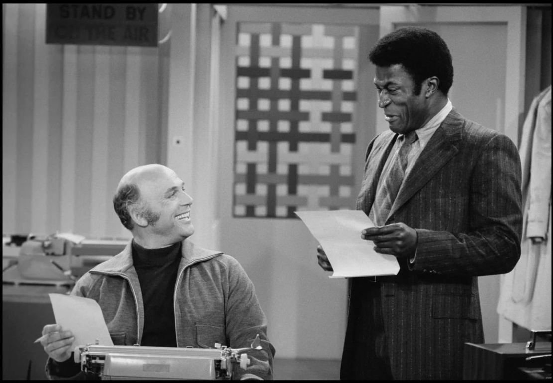 Gavin MacLeod (left) and John Amos inside 